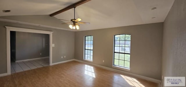 empty room with lofted ceiling with beams, ceiling fan, and light hardwood / wood-style flooring