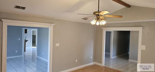 spare room with vaulted ceiling with beams and ceiling fan