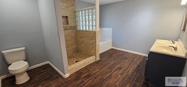 full bathroom featuring vanity, toilet, and shower with separate bathtub