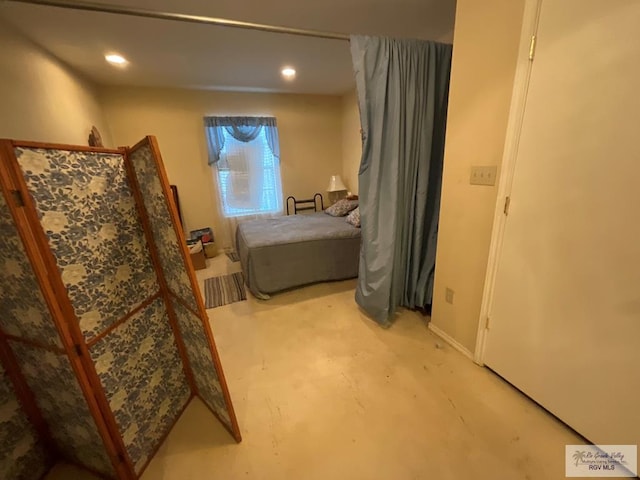 1105 Colt St, La Feria, TX 78559 - bedroom featuring concrete floors and recessed lighting
