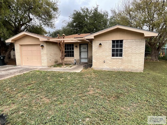 single story home with a garage and a front lawn