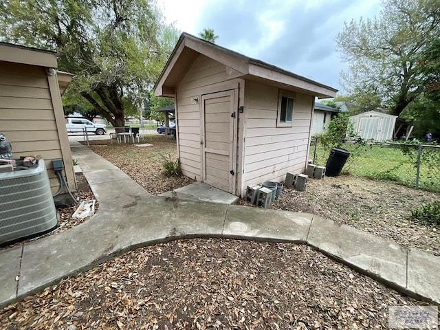 view of outdoor structure featuring central AC unit