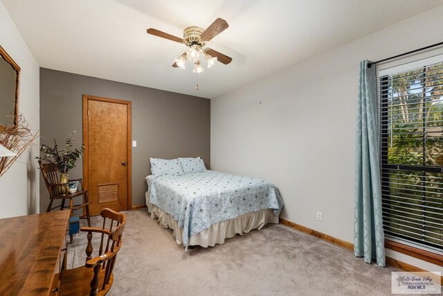 bedroom with ceiling fan and carpet