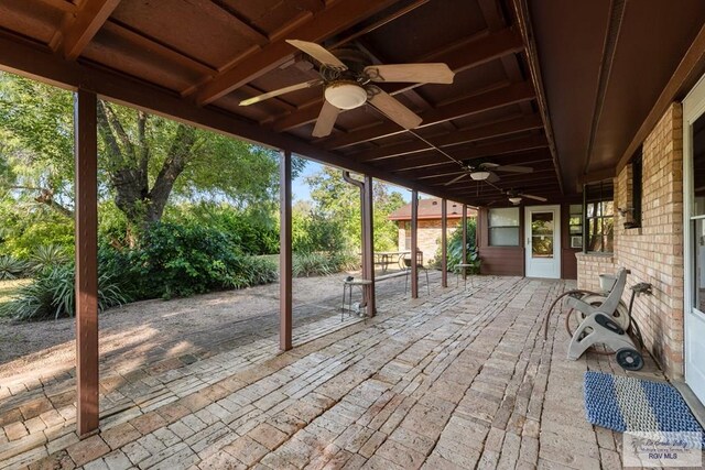 view of patio featuring ceiling fan