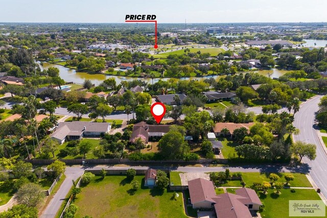 birds eye view of property featuring a water view