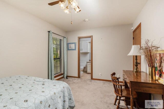 bedroom with connected bathroom, ceiling fan, and light carpet