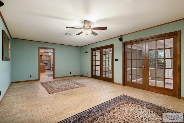 interior space with french doors, ceiling fan, and ornamental molding