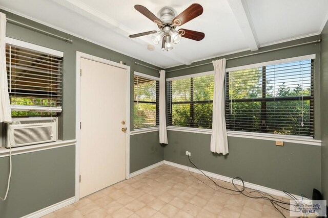 unfurnished sunroom featuring ceiling fan and cooling unit