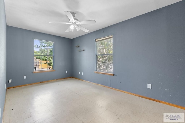 1537 E Harrison St, Brownsville, TX 78520 - unfurnished room with healthy amount of natural light, a ceiling fan, and tile patterned floors