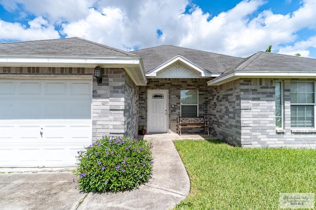 3053 Fairfield Dr, Brownsville, TX 78526 - view of front of house with a garage and a front yard