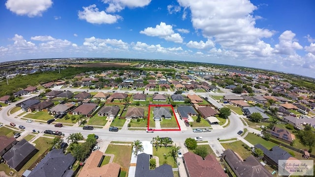 3053 Fairfield Dr, Brownsville, TX 78526 - aerial view of property and surrounding area with property parcel outlined and nearby suburban area