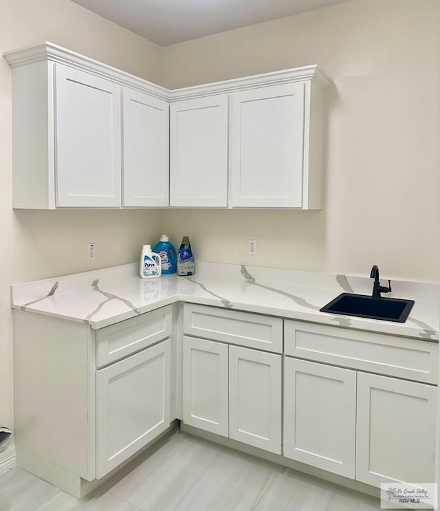 laundry area featuring a sink