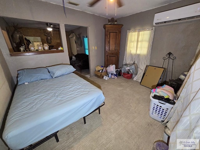 bedroom featuring carpet floors, a wall mounted AC, and ceiling fan