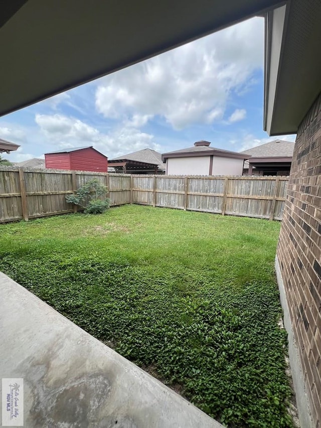 view of yard with a fenced backyard
