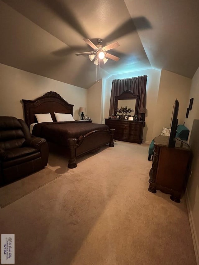 bedroom featuring light carpet, a ceiling fan, and lofted ceiling