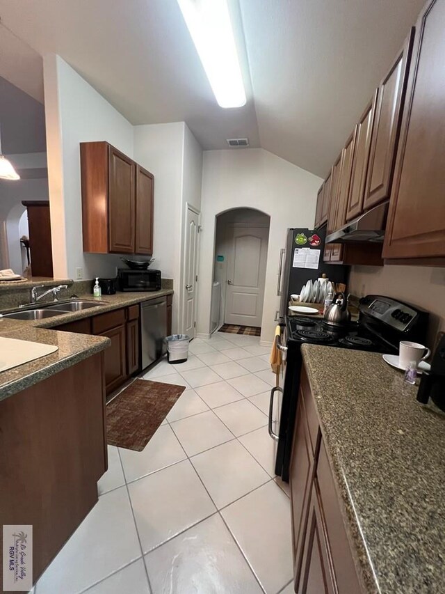 kitchen with black / electric stove, arched walkways, dishwasher, a sink, and under cabinet range hood