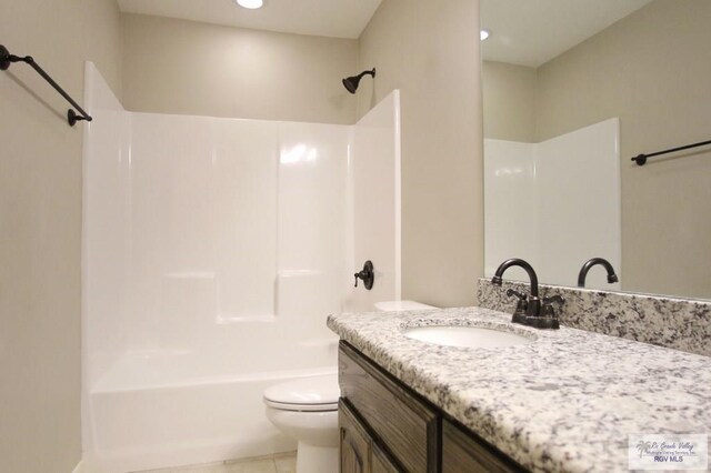 full bath featuring toilet, bathing tub / shower combination, vanity, and tile patterned floors