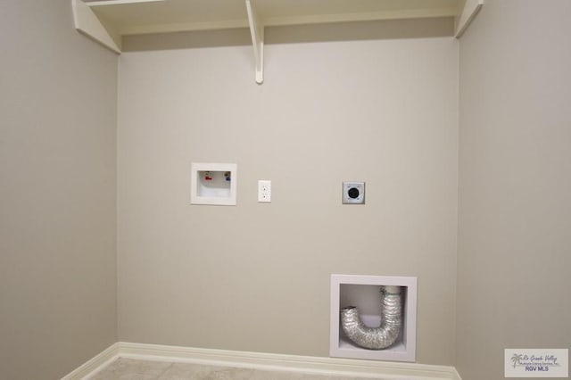 clothes washing area with hookup for a washing machine, laundry area, electric dryer hookup, and baseboards