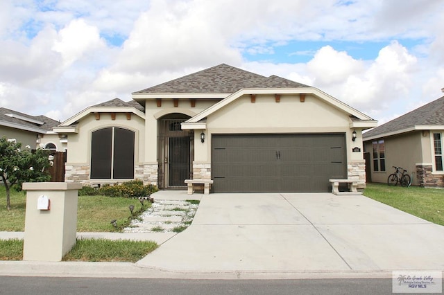 view of front of home with a shingled roof, concrete driveway, stone siding, an attached garage, and stucco siding