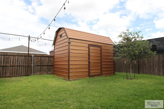 view of shed featuring a fenced backyard