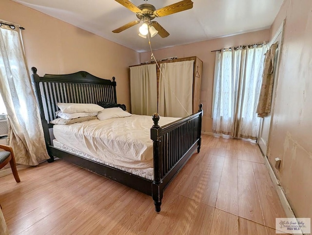 bedroom featuring ceiling fan and wood finished floors