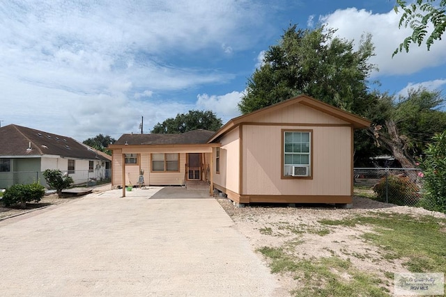 back of house featuring cooling unit and fence