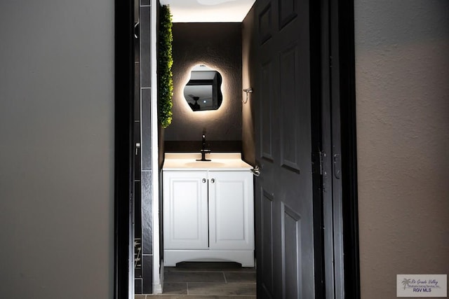 bathroom featuring wood tiled floor and vanity