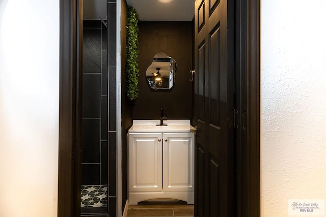 bathroom featuring vanity and a shower stall