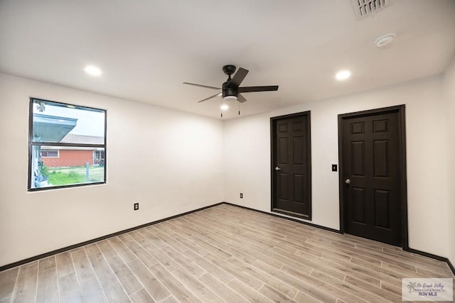 interior space with ceiling fan, light wood-type flooring, visible vents, and recessed lighting