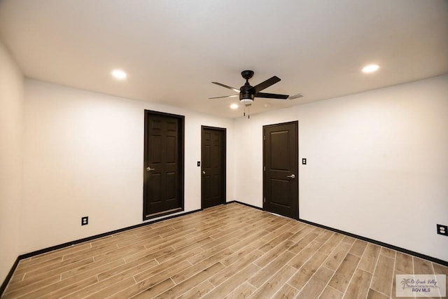 unfurnished room with baseboards, light wood-type flooring, a ceiling fan, and recessed lighting