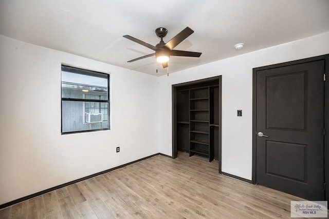 unfurnished bedroom with light wood-type flooring, baseboards, and a ceiling fan