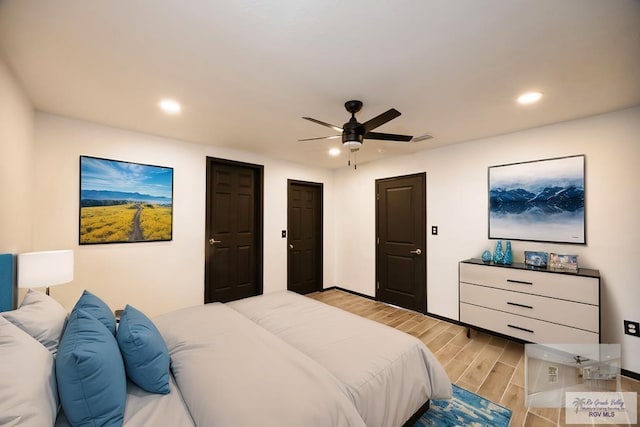 bedroom with a ceiling fan, wood finish floors, and recessed lighting