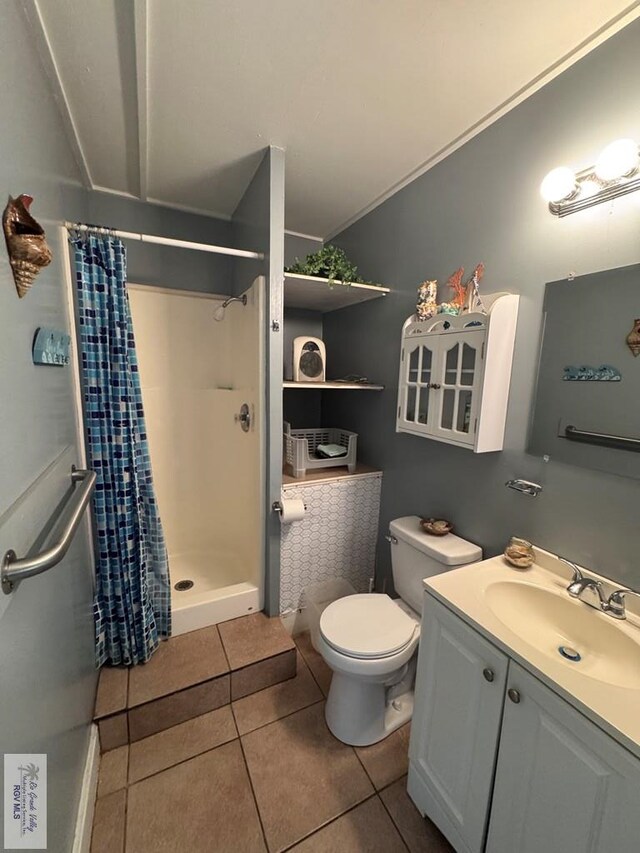 2326 Rio Hondo Rd, Harlingen, TX 78550 - full bathroom featuring a stall shower, vanity, and tile patterned floors