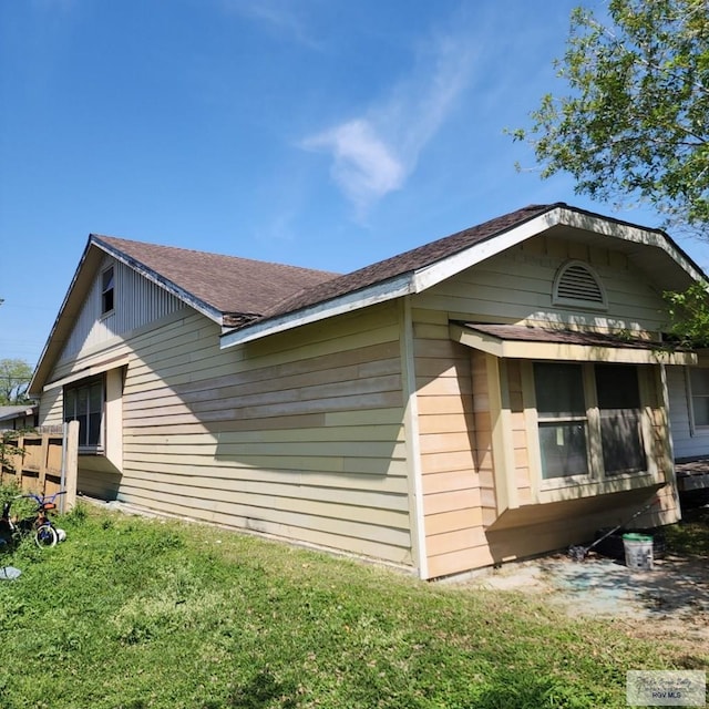 view of home's exterior featuring a yard