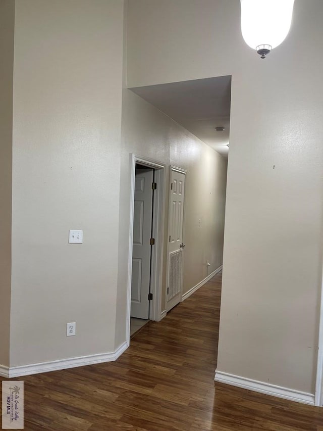 hall with dark hardwood / wood-style flooring