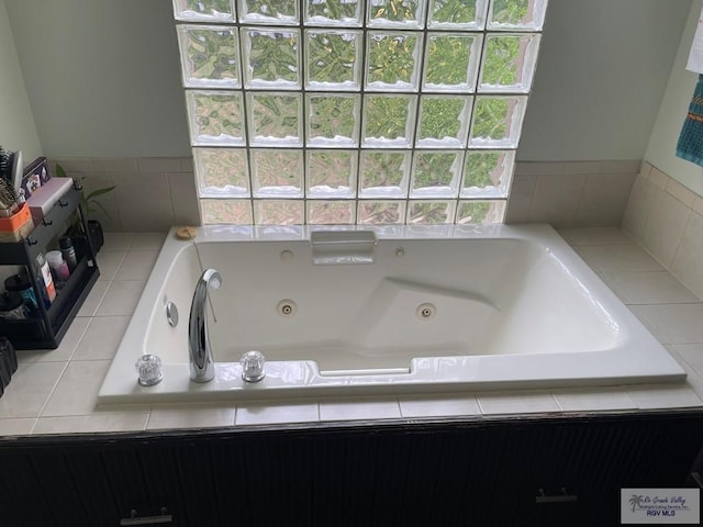 bathroom featuring a relaxing tiled tub