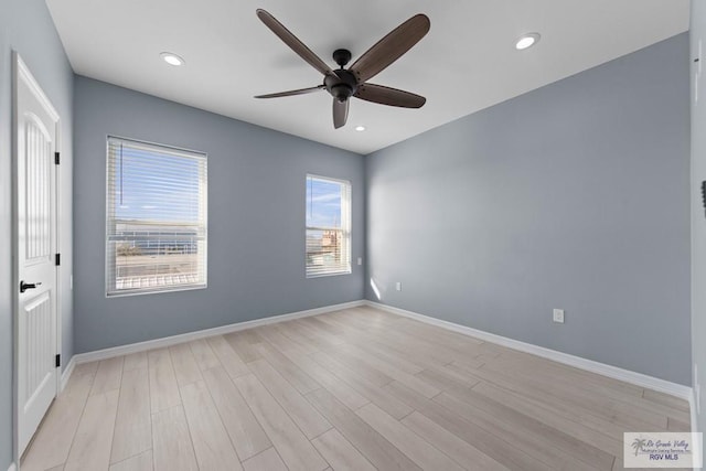 empty room featuring light hardwood / wood-style floors and ceiling fan