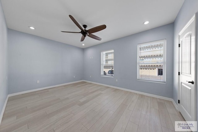 empty room featuring ceiling fan and light wood-type flooring