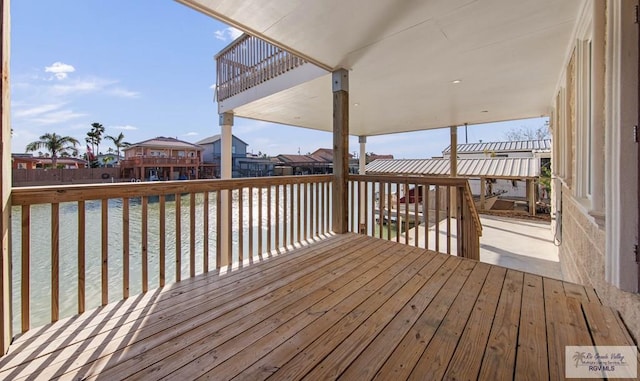 wooden deck with a water view