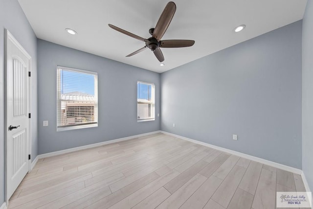 unfurnished room featuring light hardwood / wood-style floors and ceiling fan