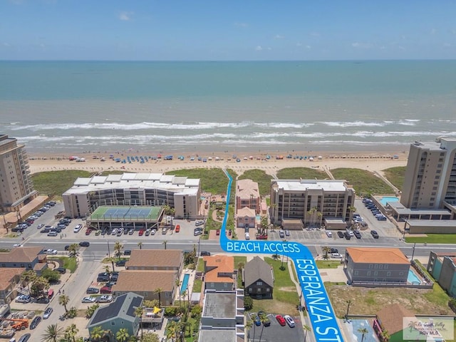 birds eye view of property with a view of the beach and a water view