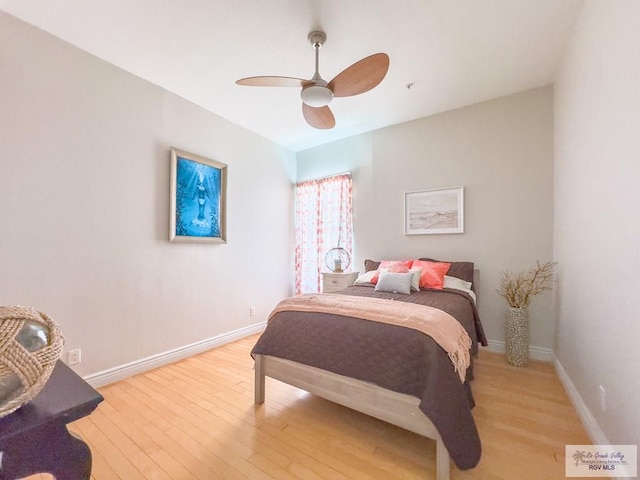 bedroom featuring hardwood / wood-style floors and ceiling fan