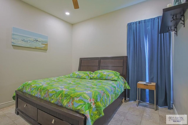 tiled bedroom with ceiling fan