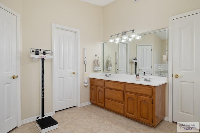 bathroom with tile patterned flooring and vanity