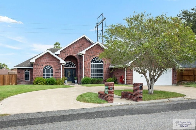 view of front facade with a front yard and a garage