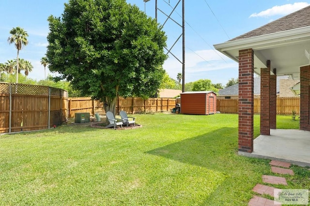 view of yard featuring a patio area and a shed