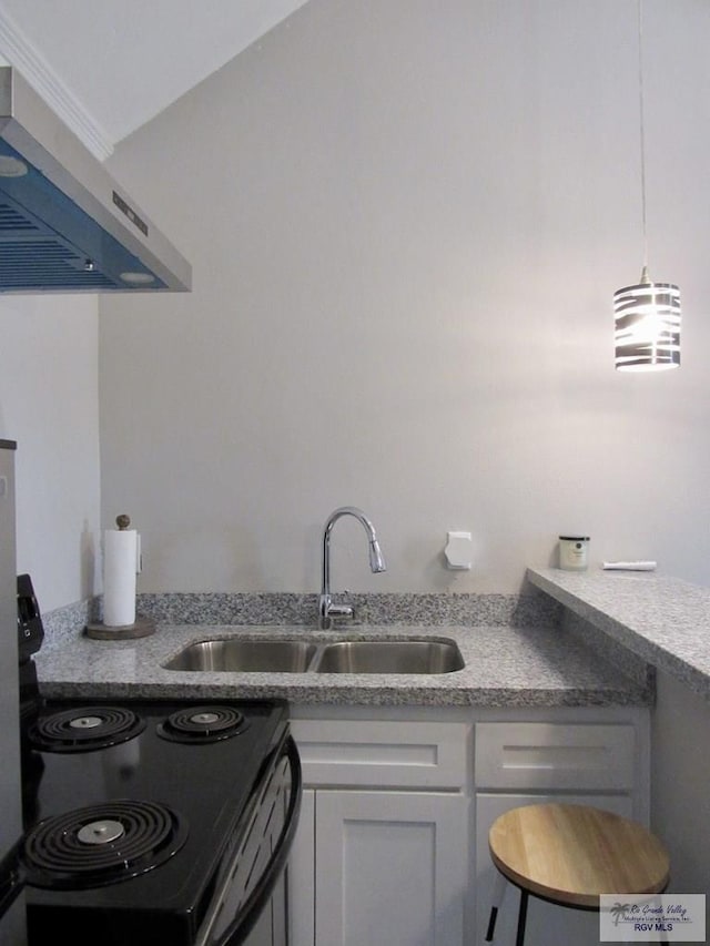 225 Country Club Rd Unit 225, Brownsville, TX 78520 - kitchen featuring white cabinetry, light countertops, exhaust hood, a sink, and range with electric cooktop