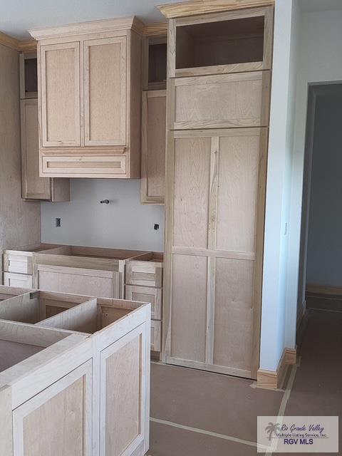 9728 Heights S Unit 9, Harlingen, TX 78552 - kitchen featuring concrete floors
