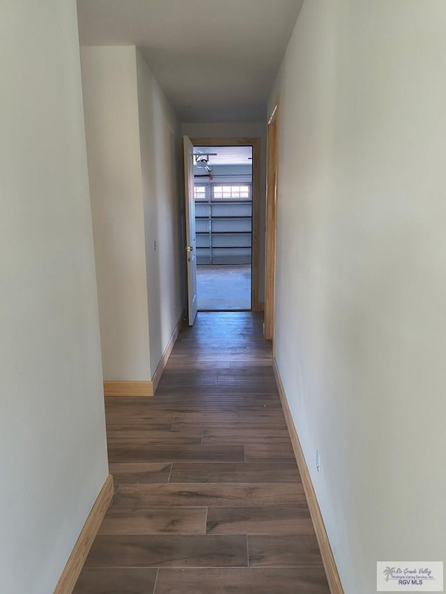 9728 Heights S Unit 9, Harlingen, TX 78552 - hall with baseboards and wood finished floors