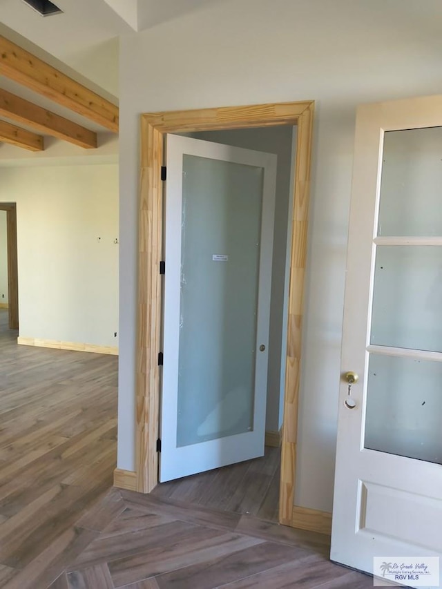9728 Heights S Unit 9, Harlingen, TX 78552 - corridor with beam ceiling and wood finished floors